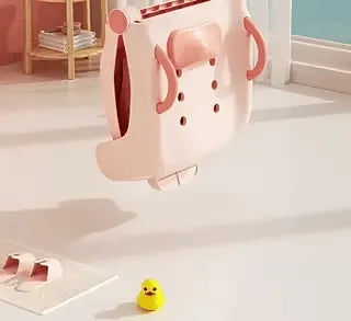 chaise de bain bébé repliée avec motif canard et poignées ergonomiques pour le transport