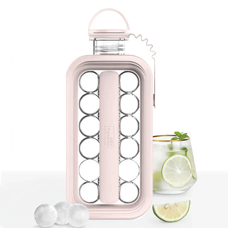 bouteille frostyballs rose avec un verre de boisson au citron vert et glaçons ronds