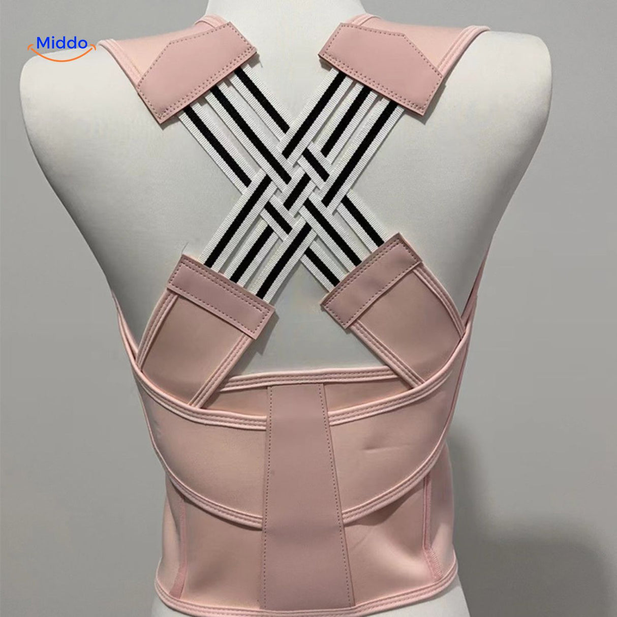 correcteur de posture dorsal en coloris rose, réglable et discret sous les vêtements