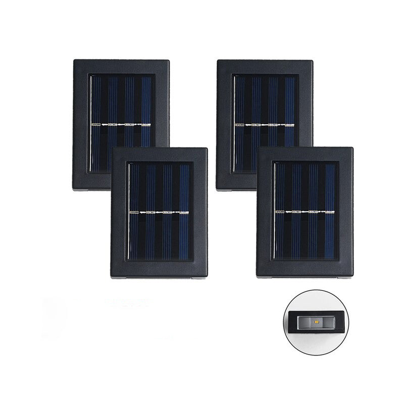 set de quatre lampes solaires LED extérieures alignées sur fond blanc