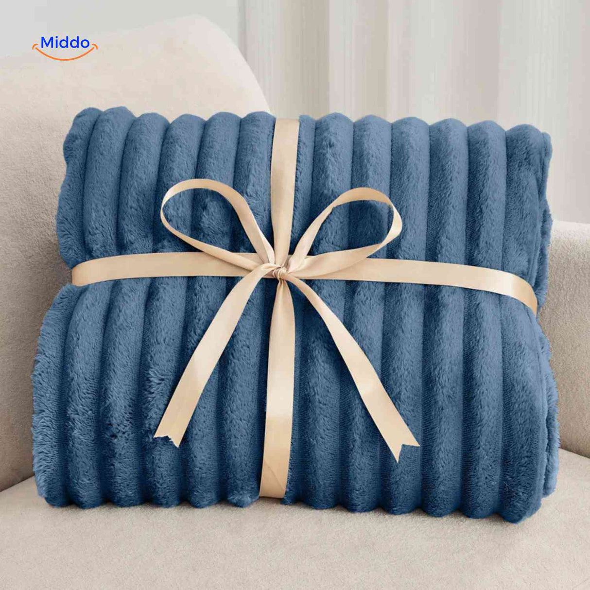 plaid en peluche présenté comme cadeau original, emballage soigné et texture douce