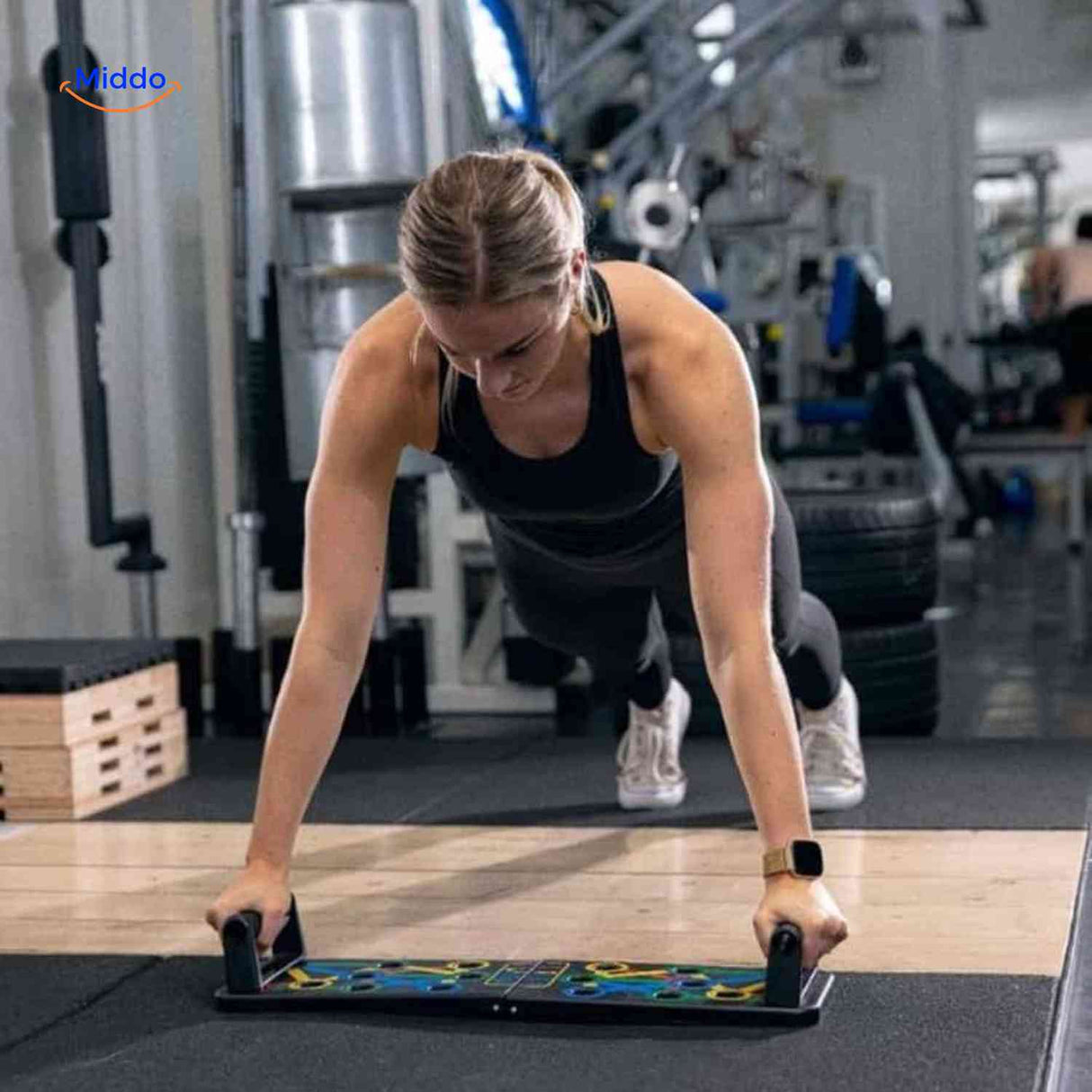 femme réalisant des pompes avec le push-up board et ses poignées ergonomiques