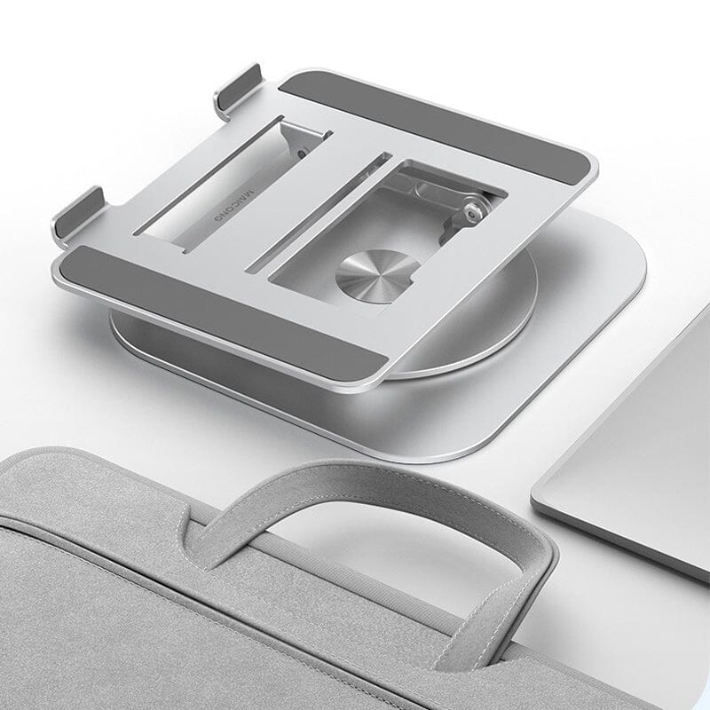 support pliable pour ordinateur portable posé à côté d'un sac sur une surface blanche