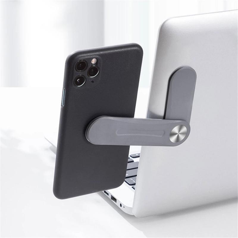 support téléphone magnétique gris fixé sur le côté d'un ordinateur portable pour second écran