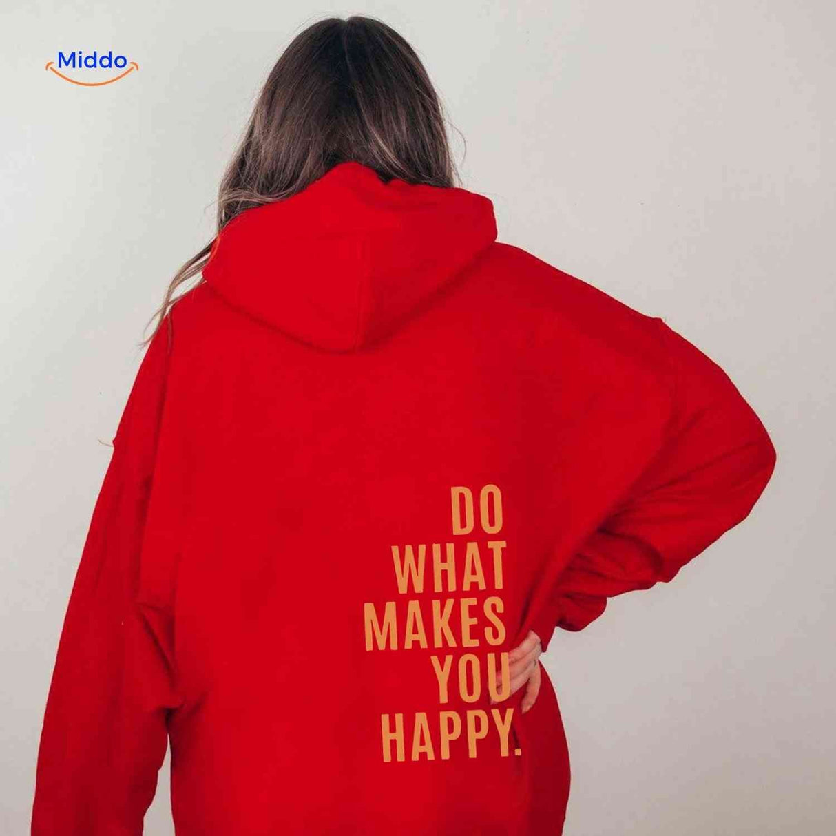 sweat à capuche oversize rouge avec inscription do what makes you happy en orange