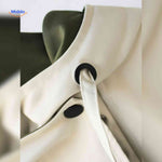 AquaShell jas detailfoto creme met groen en knopen www.middo.nl