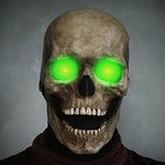 Schedelmasker met felgroene ogen en grijnzende mond