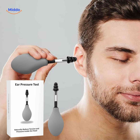 appareil de pression auriculaire utilisé par un homme pour soulager les céphalées et la pression dans la tête