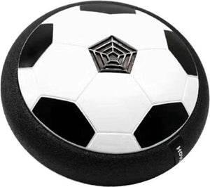 ballon de football flottant en forme de disque noir et blanc qui vole au-dessus du sol sur fond blanc