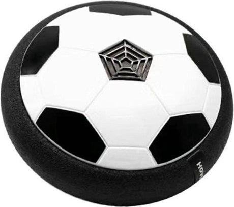 ballon de football flottant en forme de disque noir et blanc qui vole au-dessus du sol sur fond blanc