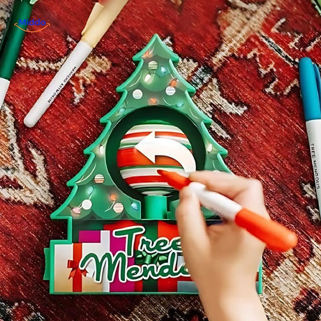 décoration de boule de noël avec un stylo peinture électrique, gros plan sur le détail