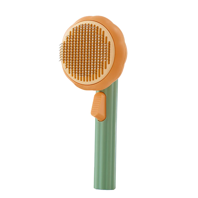 brosse autonettoyante pour chat en coloris orange et vert, idéale pour démêler les poils