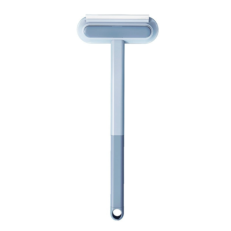 brosse anti-poils avec manche gris conçue pour éliminer les poils d'animaux de compagnie