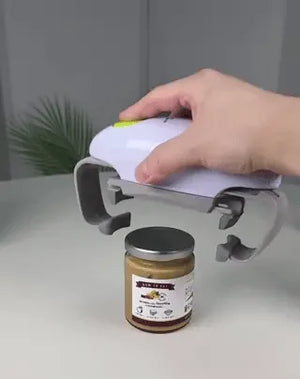 ouvre-bocal automatique sur un pot de miel, couvercle retiré en un seul clic