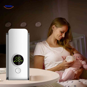 chauffe-biberon portable sans fil : mère qui nourrit son bébé la nuit grâce à la chaleur constante