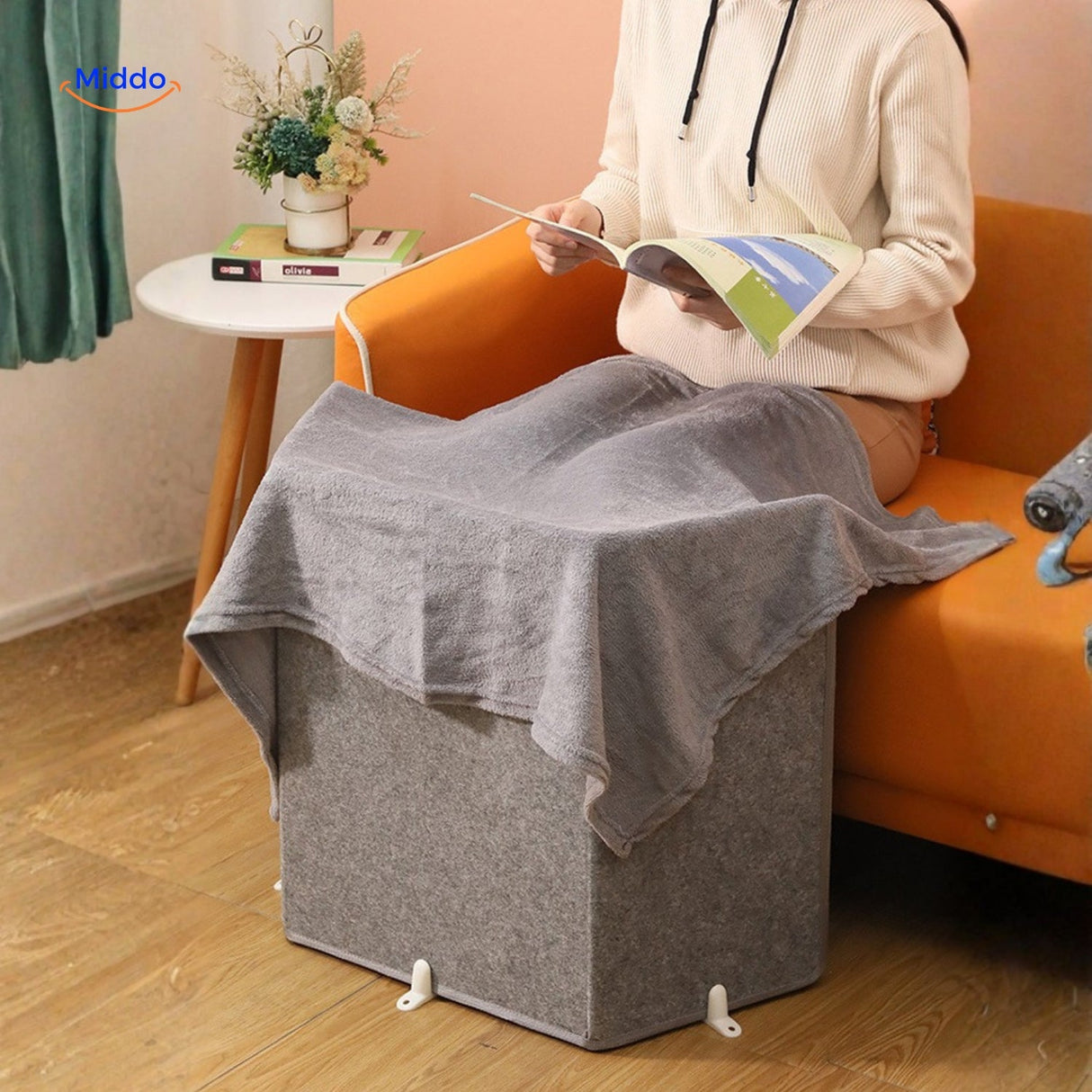chauffe-jambes électrique utilisé avec une couverture pour une chaleur supplémentaire