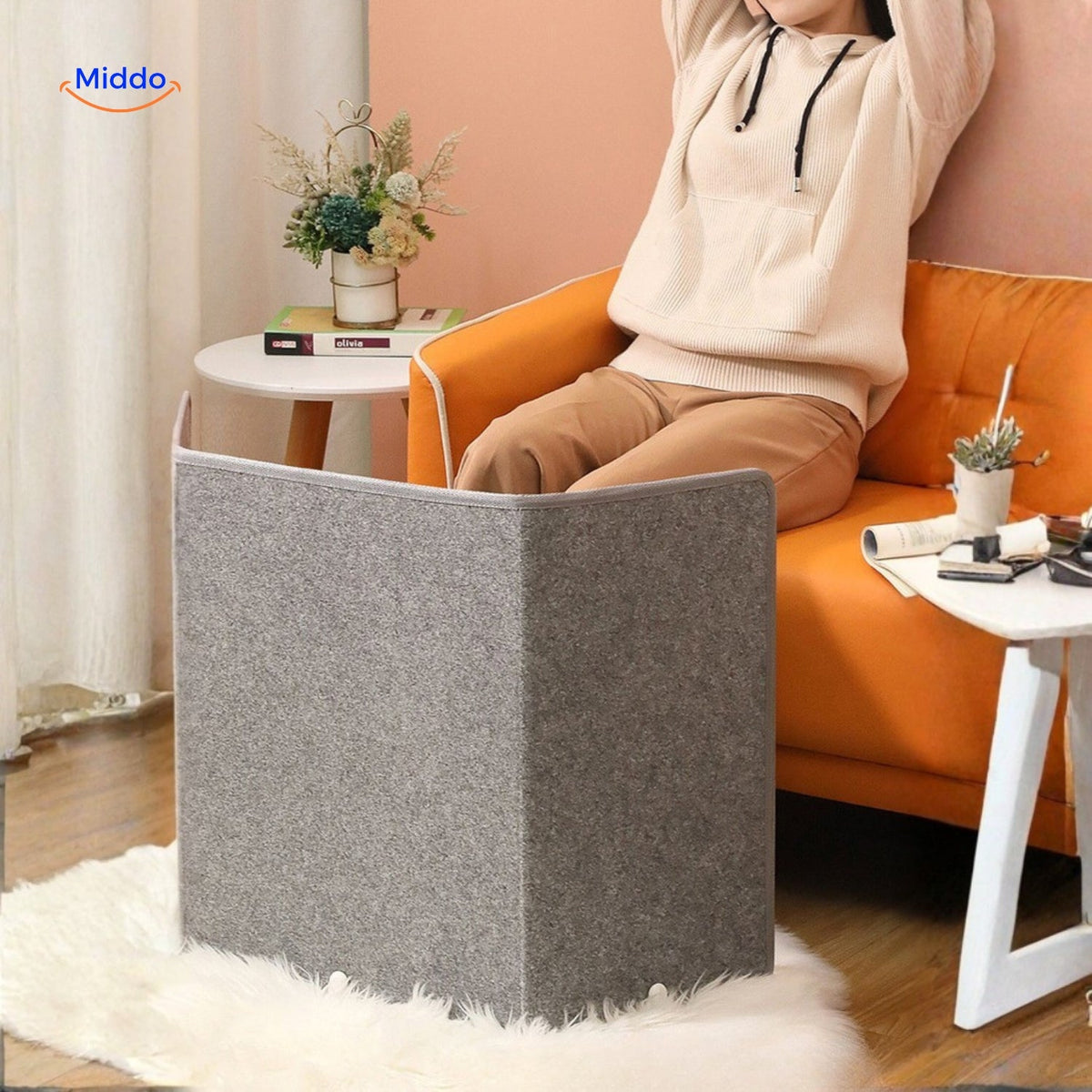 chauffe-jambes électrique avec pieds bien au chaud posés sur le canapé