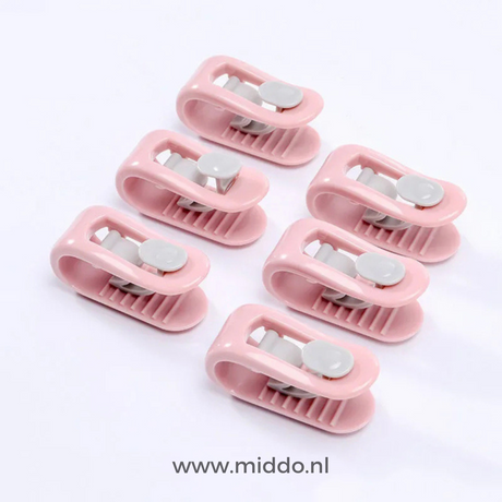 six clips anti-glissement pour couette coloris rose sur fond blanc