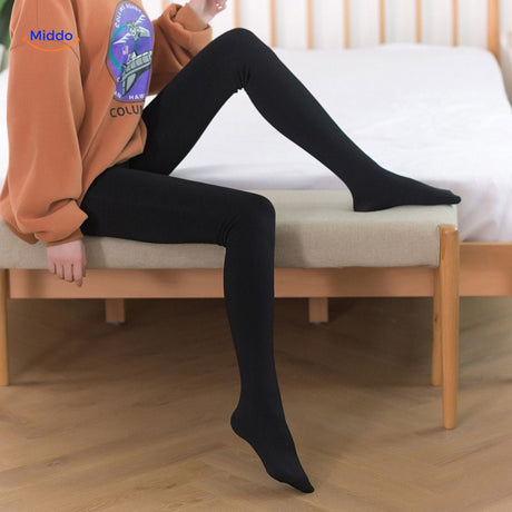 collants thermiques beige et noirs présentés déroulés pour montrer la longueur