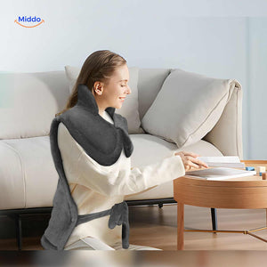 coussin chauffant électrique utilisé pour lire et se relaxer à la maison