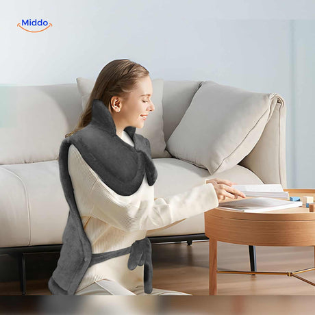 coussin chauffant électrique utilisé pour lire et se relaxer à la maison