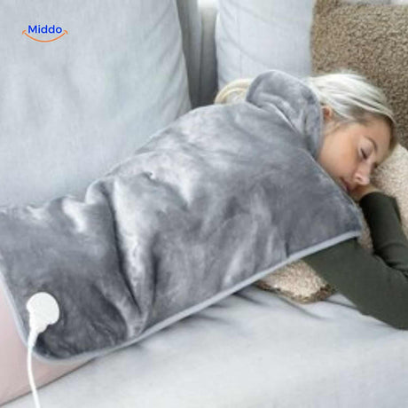 coussin chauffant électrique utilisé en position allongée pour une relaxation profonde
