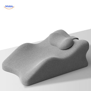 coussin gris avec appui-tête pour maintien de la nuque et détente profonde