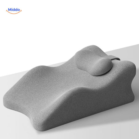 coussin gris avec appui-tête pour maintien de la nuque et détente profonde