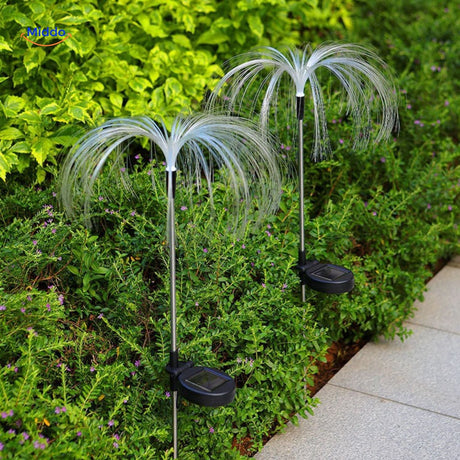 fontaine solaire fiber optic avec design floral multicolore illuminé dans le jardin