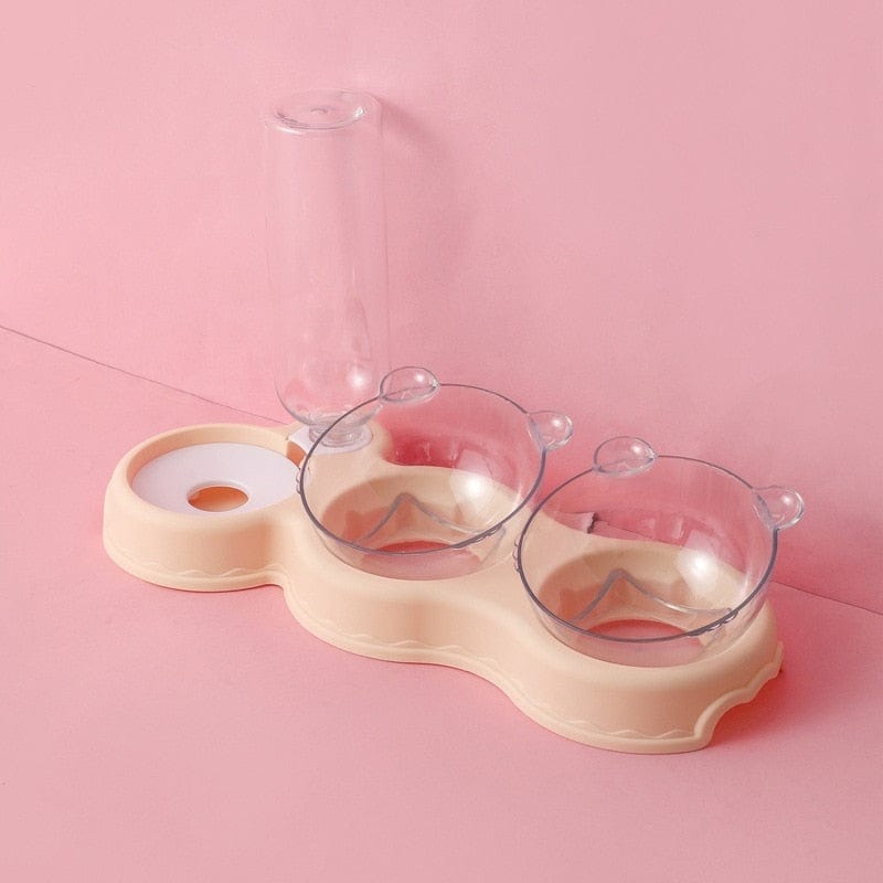 plateau gamelle 3 en 1 coloris beige présenté sur fond rose, coupelles et bouteille vides