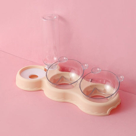 plateau gamelle 3 en 1 coloris beige présenté sur fond rose, coupelles et bouteille vides