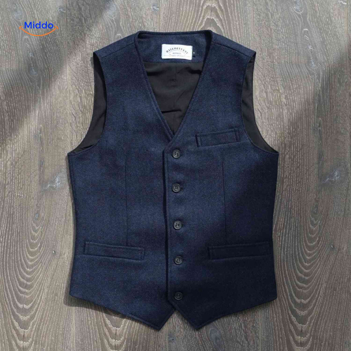 face avant du gilet laine tweed coloris bleu, motif chevron distinctif