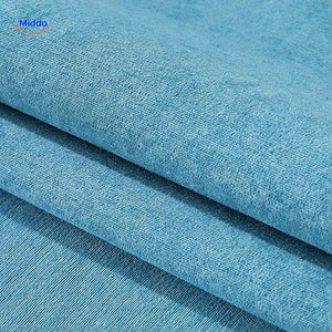 gros plan du tissu chenille bleu de la housse de canapé, texture veloutée