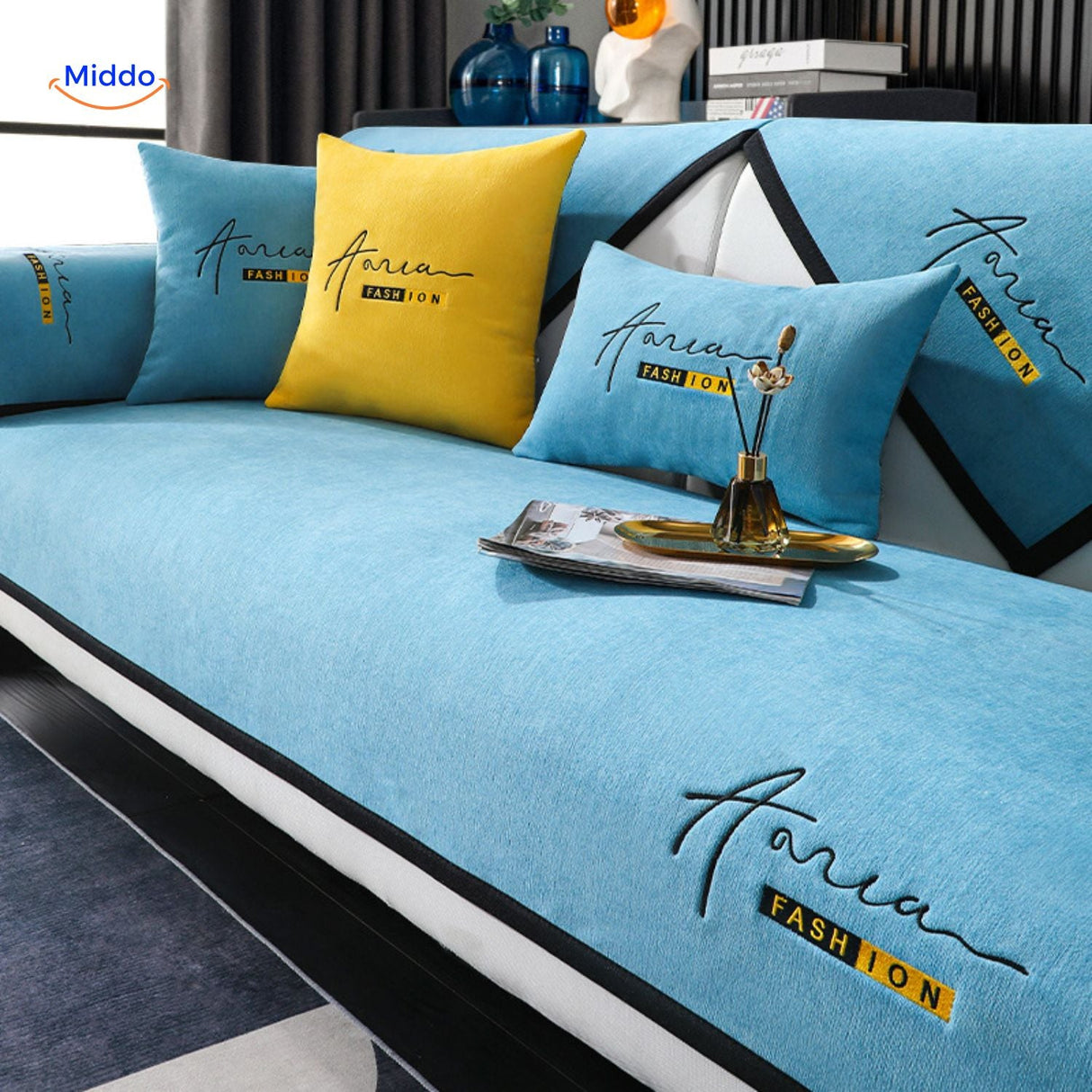 housse de canapé bleu et jaune au style graphique, lavable en machine