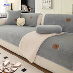 housse de canapé effet peau de mouton coloris bleu-gris avec plaids assortis