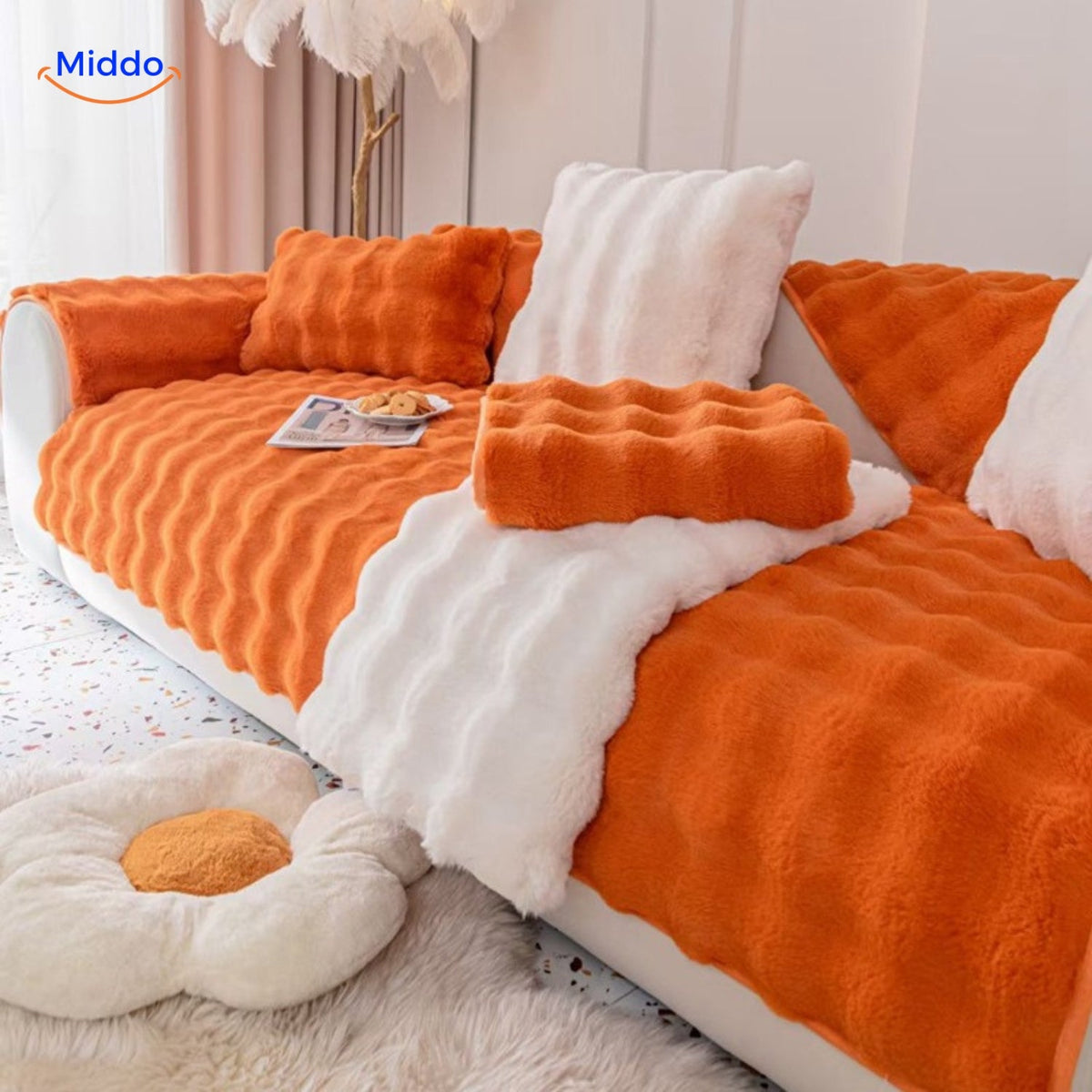 housse de canapé orange et blanche avec coussins assortis pour une déco chaleureuse