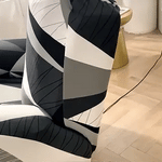housse extensible pour fauteuil relax avec motif géométrique noir, blanc et gris, vue en situation