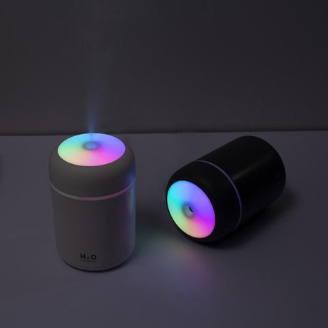 humidificateur d'air magic air en version noire et blanche, éclairage LED doux pour une ambiance nocturne relaxante