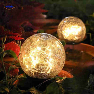 lampe solaire led décorative insérée dans un pot de fleurs extérieur