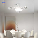 lampe ventilateur design installée au plafond d'une salle à manger lumineuse