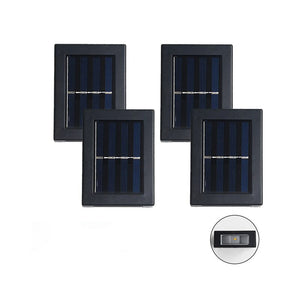 set de quatre lampes solaires LED extérieures alignées sur fond blanc