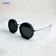 lunettes de soleil rondes coloris noir, monture légère, style vintage moderne
