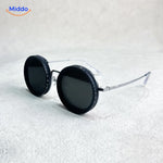 lunettes de soleil rondes coloris noir, monture légère, style vintage moderne