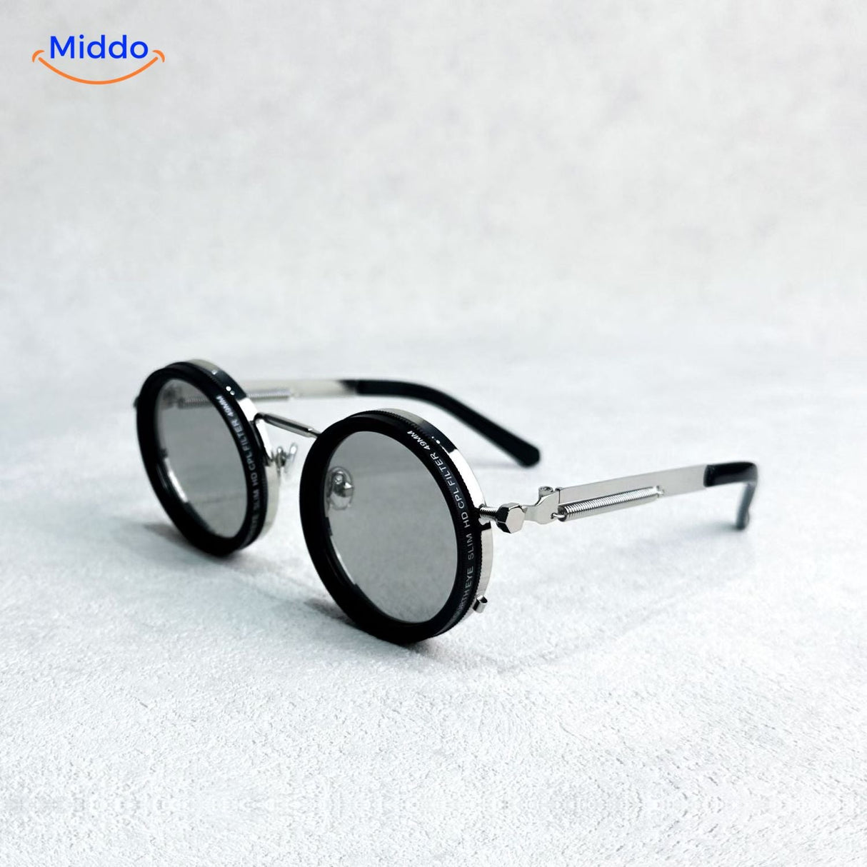 lunettes de soleil rondes à monture métallique argentée, design épuré protection UV