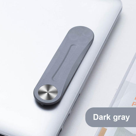clip magnétique gris replié sur un ordinateur portable, vue de côté