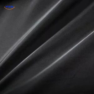manteau en laine noir, texture du tissu en gros plan