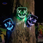 trois masques LED halloween illuminés devant un arbre la nuit, aperçu des coloris