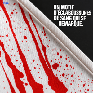 BloodstainFX tablier de costume d’Halloween: gros plan du motif d’éclaboussures rouges sur tissu blanc.