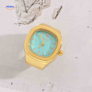 montre-bague dorée avec cadran vert menthe, design tendance et lumineux