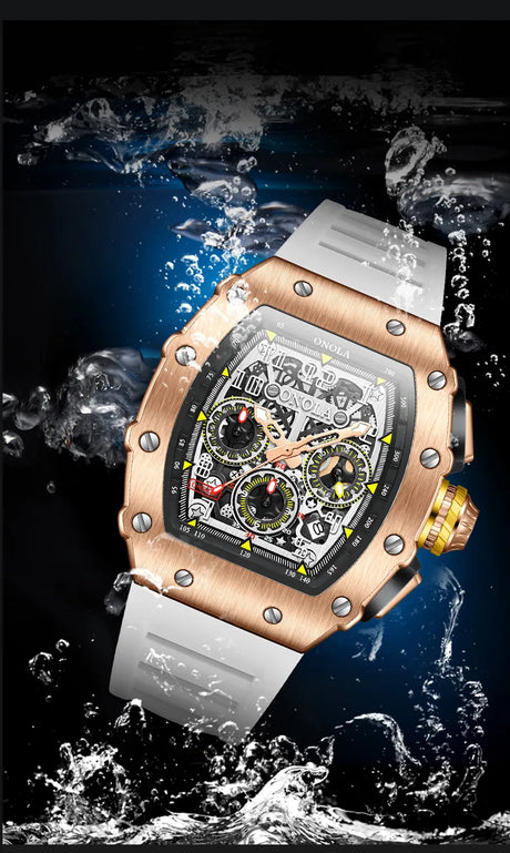 montre chronographe boîtier or rose et bracelet blanc immergée sous l'eau, résistance à l'eau démontrée